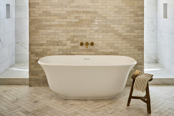A luxury bathroom with a white bathtub remodeled by CactusNectar LLC, a residential general contractor in Tucson and Phoenix