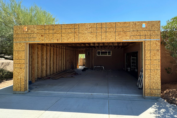 Front view of a car garage project under construction by CactusNectar LLC